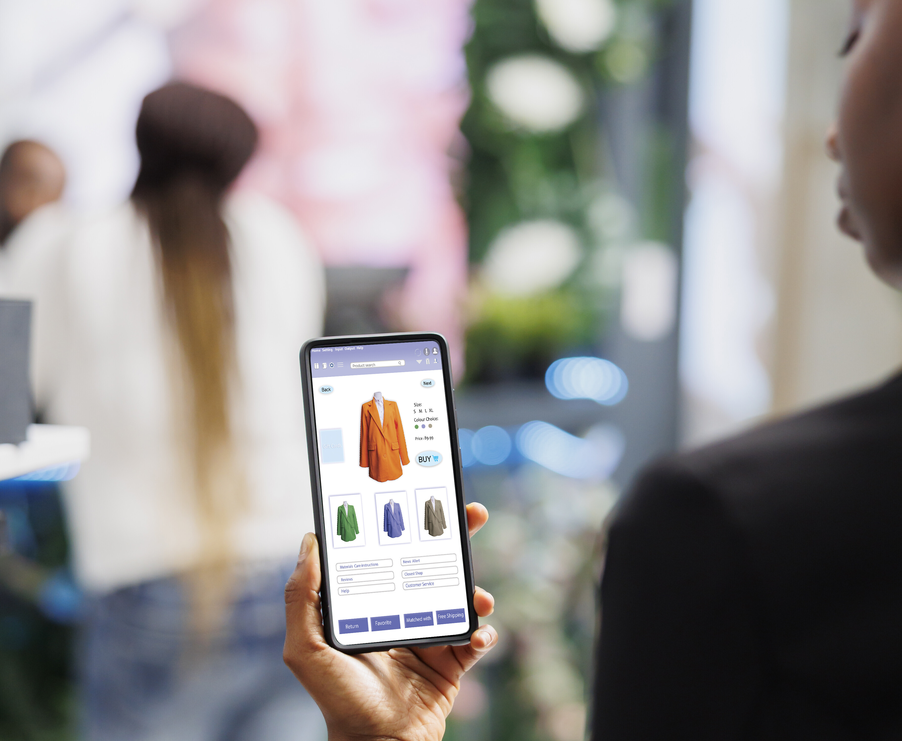 mulher negra aparentemente usa um app de vendas para comprar um blazer